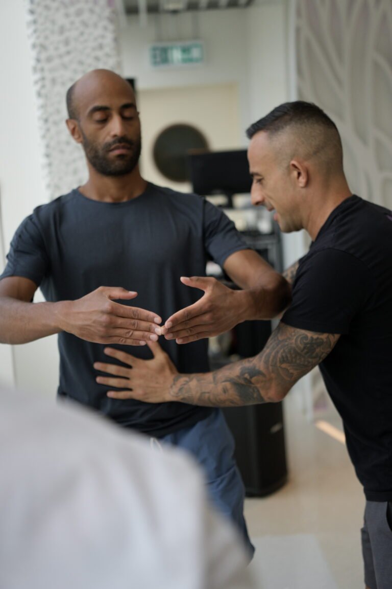 Sifu Nima guilding guy in blue tshirt, at the Sept Camp in Hong Kong