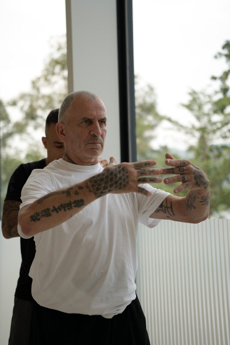 International Class Training in Hong Kong, focusing in on guy in white shirt with focused expression